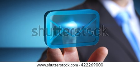 Businessman holding a digital 3D email icon in his hand '3D rendering'