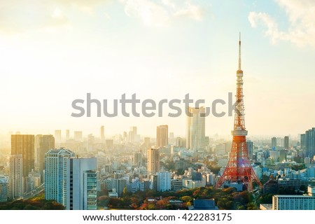Business concept for real estate and corporate construction - Tokyo tower, landmark of Japan, and panoramic modern city bird eye view with dramatic sunrise and morning sky