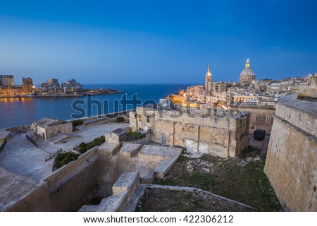 Valletta, Malta - Ancient walls of Valletta and St.Paul's Anglican Cathedral and houses of Sliema at blue hour