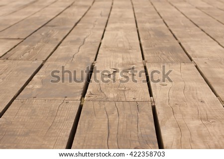 Wooden Decking on a Pier with a Symbol of a Fish
