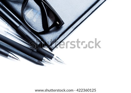 Notebook, pencil and glasses