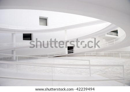 Modern white abstract building with windows and sloopes