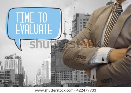businessman stand with speech bubble TIME TO EVALUATE text  