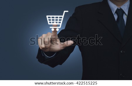 Businessman pressing shopping cart icon over blue background, Shopping online concept
