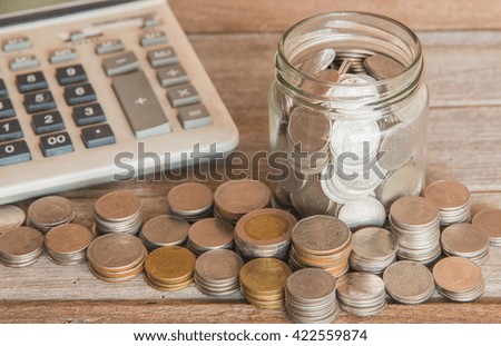 Saving money concept,Male hand putting money coin stack growing business
