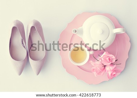Vintage heels, tea cup, teapot and roses flat lay