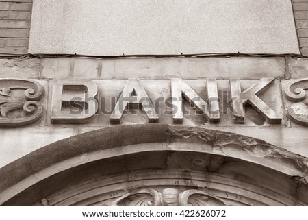 Bank Sign on Building Facade in Black and White Sepia Tone