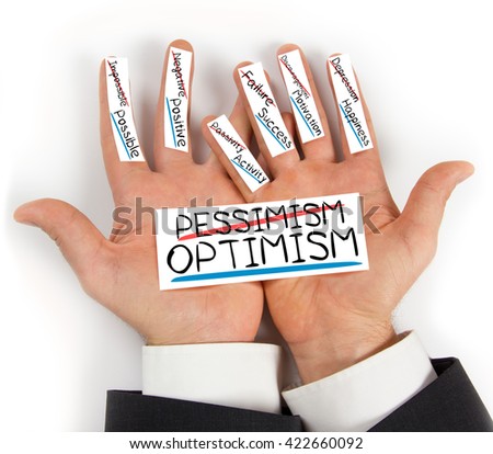 Photo of hands holding paper cards with PESSIMISM OPTIMISM concept words