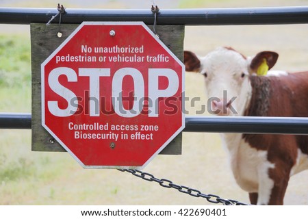 A sign is posted in an attempt to keep germs and disease infecting farm animals/Bio Security or Biosecurity and Farm Animals/A sign is posted to keep germs and disease infecting farm animals. 