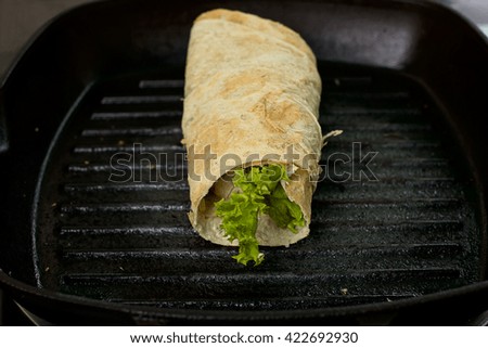  Mexican food, burrito on frying pan