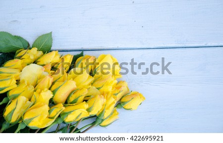 Beautiful flower on grunge wooden table