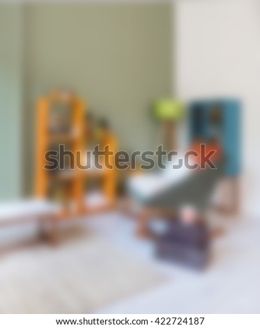 blurred modern living room chair green wall