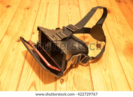 VR Glasses on top of wooden background. close up