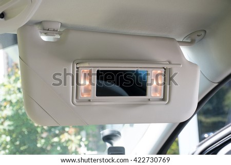 Car sun visor with illuminated mirror Royalty-Free Stock Photo #422730769