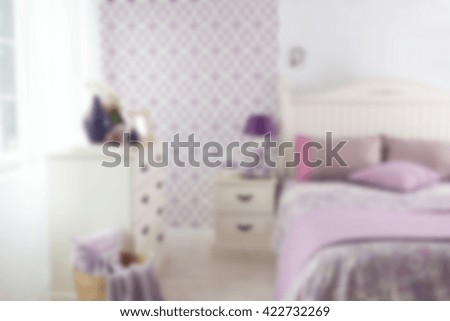 blurred modern bedroom interior and purple decor