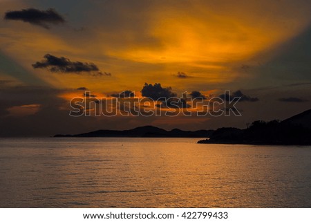 Sunset at the sea, with orange sky in the evening