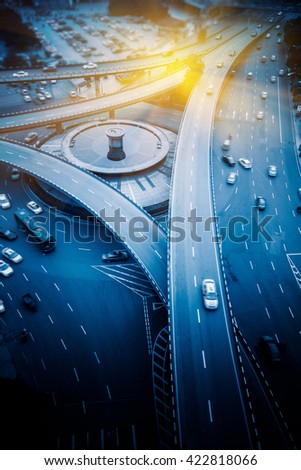 aerial view of traffic on chongqing overpass on a sunny day,china,blue toned image.