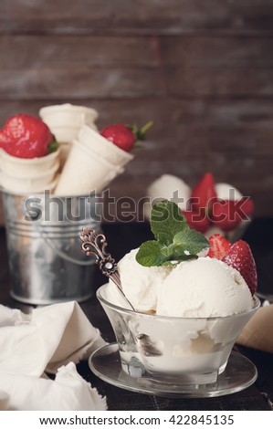 Delicious bowl of strawberry ice cream in table Tonned photo