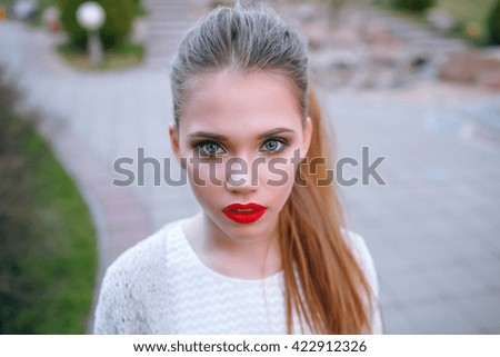 Portrait of beautiful Girl in white dress closeup