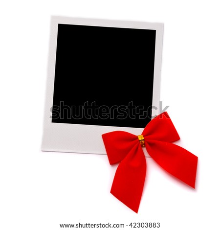 Old photo card with red bow isolated on a