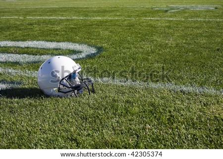 Football Helmet on field background