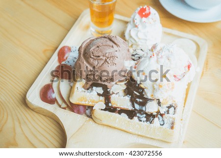 Belgian waffles with ice cream, icing sugar, chocolate and fresh fruit - Vintage effect style pictures