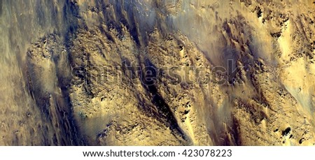 the golden, abstract photography of the deserts of Africa from the air. aerial view of desert landscapes, Genre: Abstract Naturalism, from the abstract to the figurative, contemporary photo art
