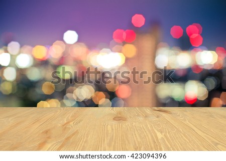 light bokeh above wooden floor , for display your product