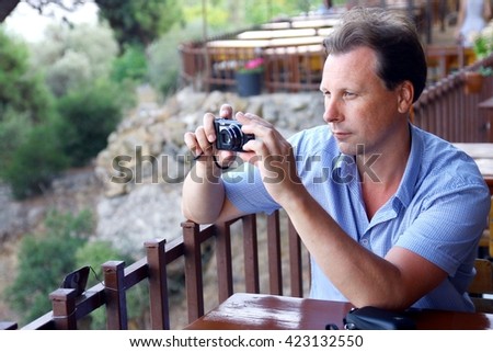 White men taking photo of landscape