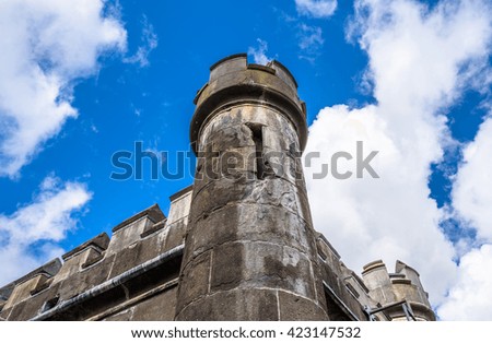 Corner tower of a Victorian style castle building.