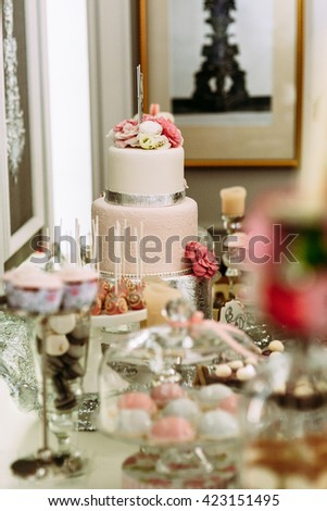 Tasty wedding cake decorated with flowers