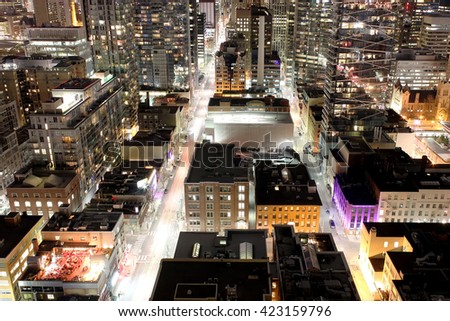 Close up of buildings and skyscrapers in downtown Toronto financial district at night