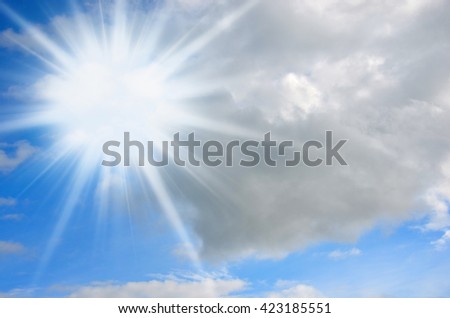 Sun in the blue sky with clouds. Brightly sunlight, sunny day. 