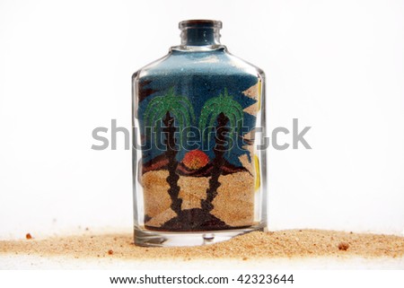 Bottle with a picture from colour sand.