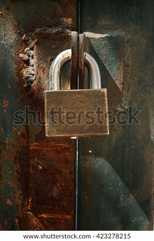 Closed metal lock and long shadow