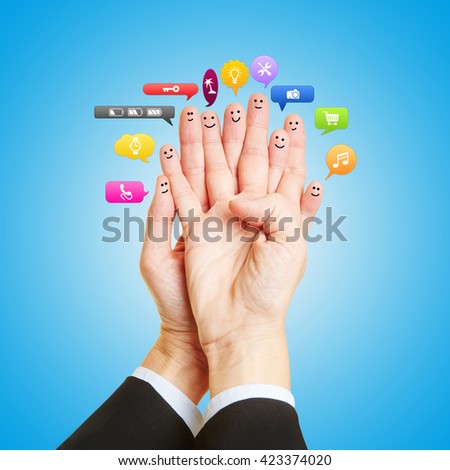 Group as smileys on fingers talking with many colorful speech bubbles
