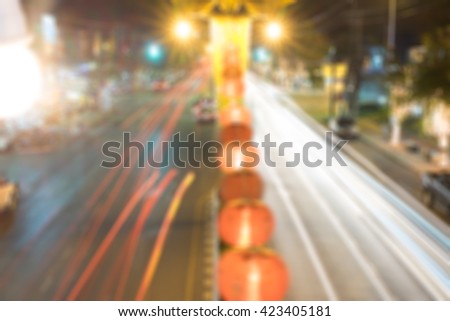 Out of focus lights of urban traffic in a city of Kanchanaburi, Thailand