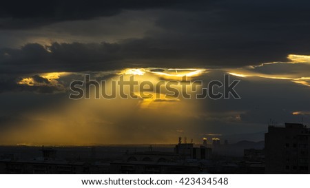 The Armenian Nuclear Power Plant and the sun, view from Yerevan, Armenia. Beautiful sunset. Perfect background for a text