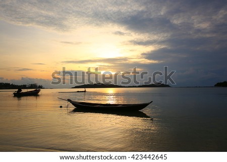 Sunrise over beautiful blue sky with sun shining through clouds, Fisherman's village Samui Island, Thailand.