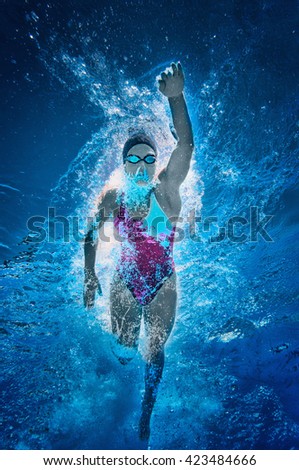 Front crawl swimmer. Underwater view, toned image