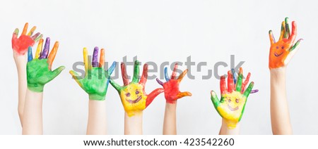 Lot of painted hands raised up. Group of multiracial funny children Funny kids hands up. World Conference for Well-being of Children in Geneva, Switzerland, June 1 Universal Children's Day 20 November Royalty-Free Stock Photo #423542260