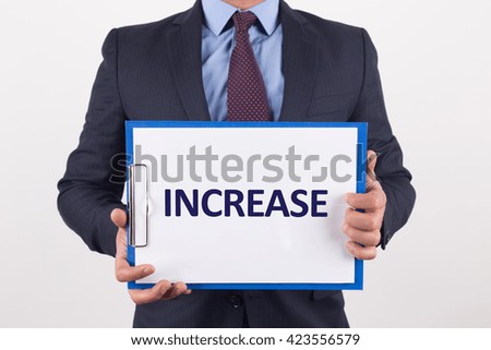 Man showing paper with INCREASE text