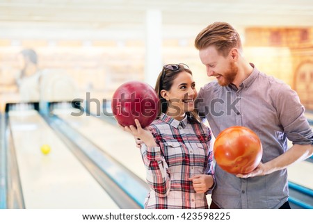 Dating couple enjoy bowling together