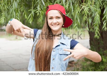 Portrait teen girl in jacket on nature