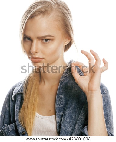 young blond woman on white backgroung gesture thumbs up, isolated emotional posing close up