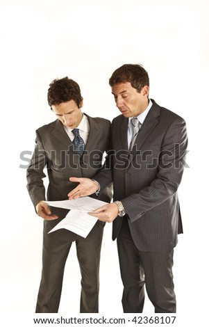 Two businessmen looking at documents