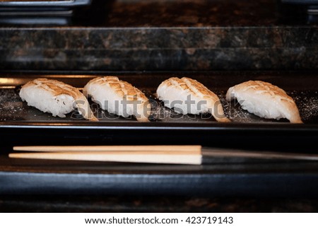 Closed up of cured halibut nigiri