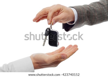 Hands and car key isolated on white background