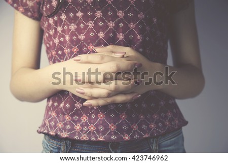 Young woman hands folded in front