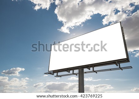 Billboard - Empty billboard in front of beautiful cloudy sky in a rural location Royalty-Free Stock Photo #423769225